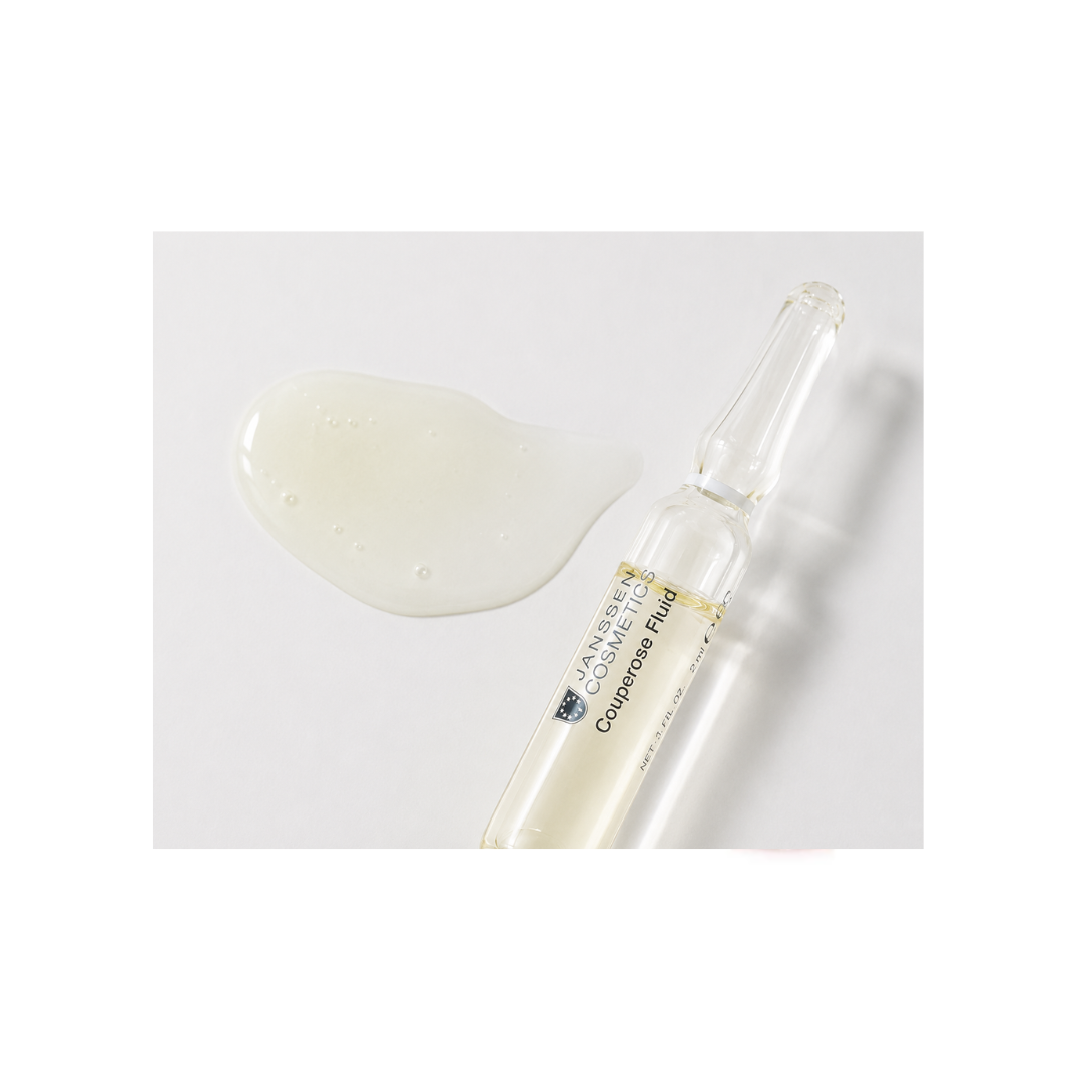 Texture of Janssen Cosmetics Couperose Fluid Ampoules on a white background.