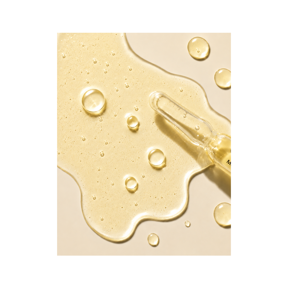 Texture of Janssen Cosmetics Melafadin Fluid Ampoules on a white background.