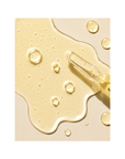 Texture of Janssen Cosmetics Melafadin Fluid Ampoules on a white background.